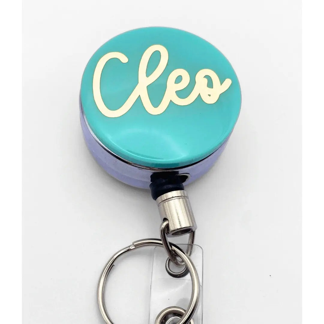a close up of a badge on a key chain