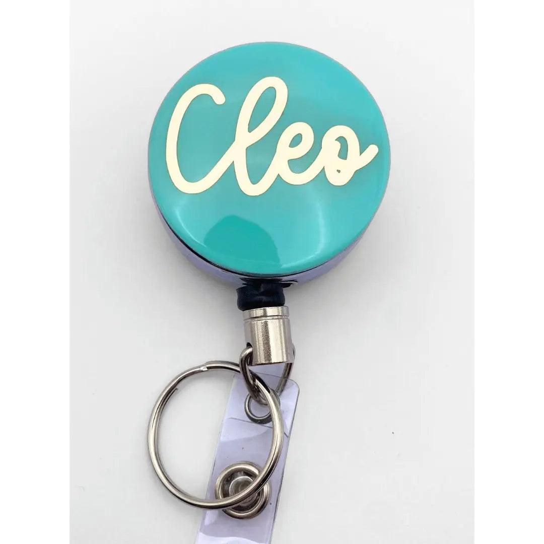 a close up of a badge on a key chain