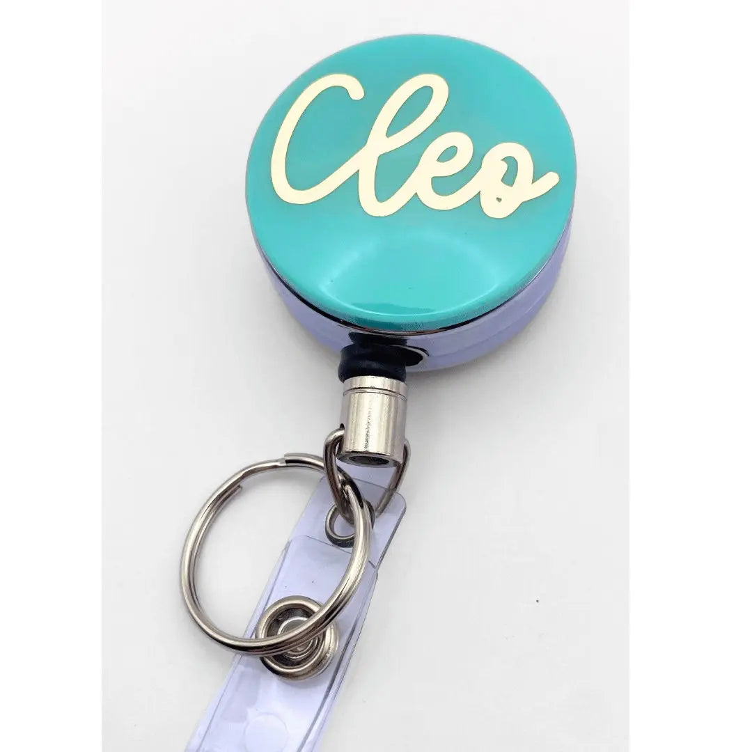 a close up of a key chain on a white surface