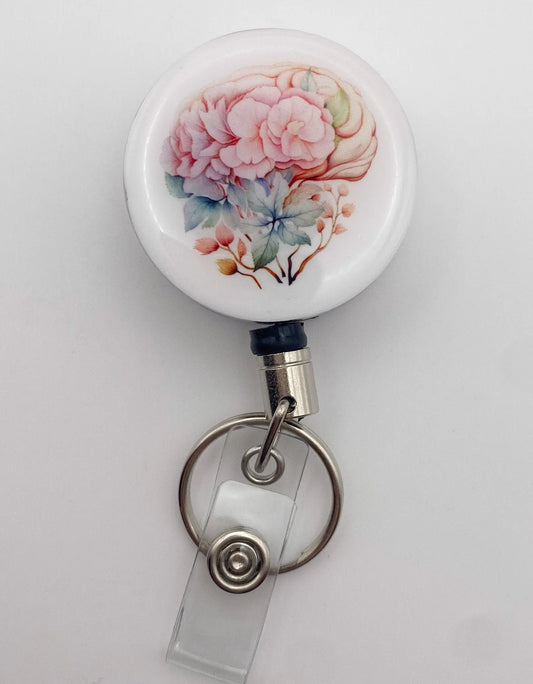 Heavy duty badge reel with beautiful watercolour floral brain image sealed with resin. Perfect for anyone working in Neuorology or anyone who just loves to wear art on their belts.