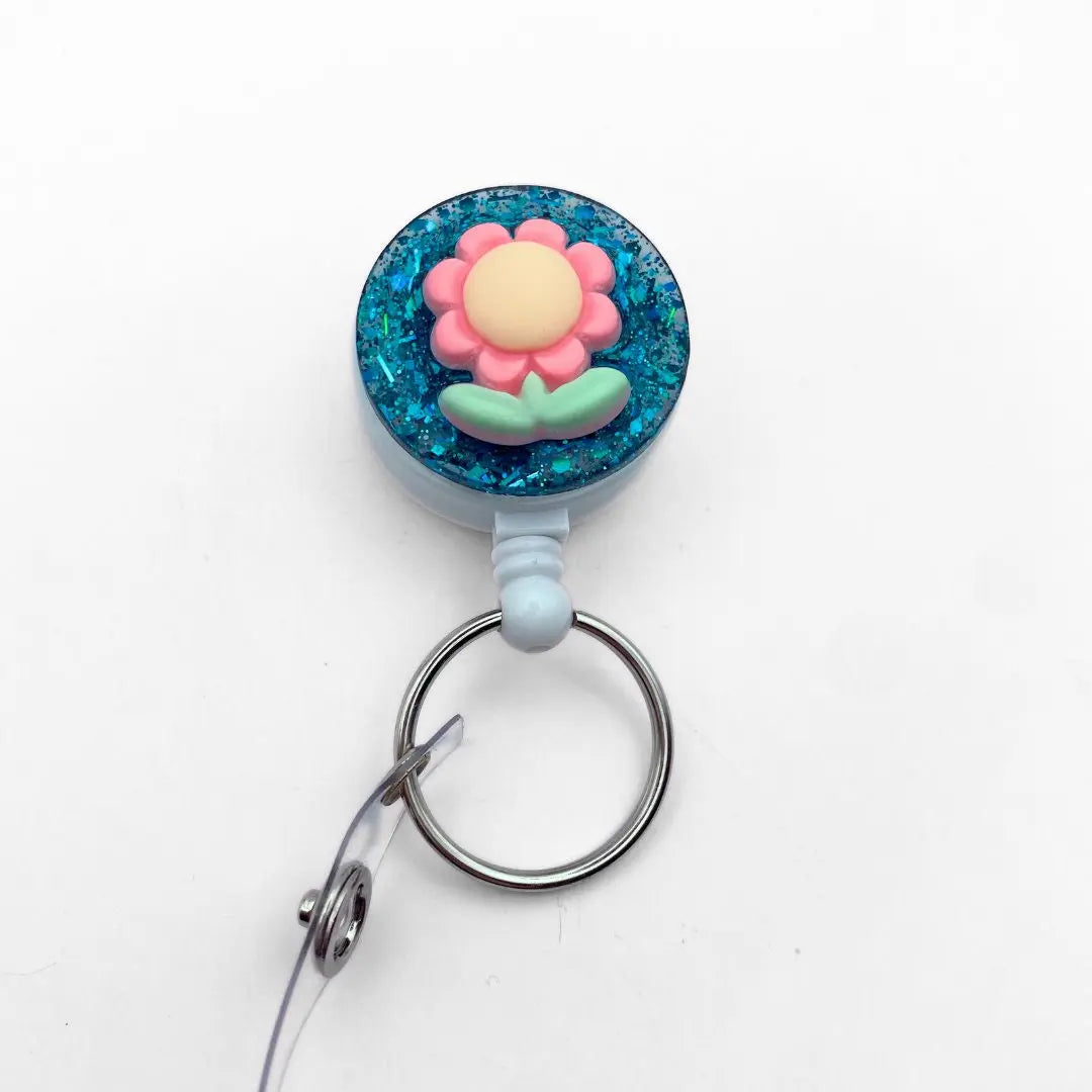 Lightweight badge reel - green glitter and flower.