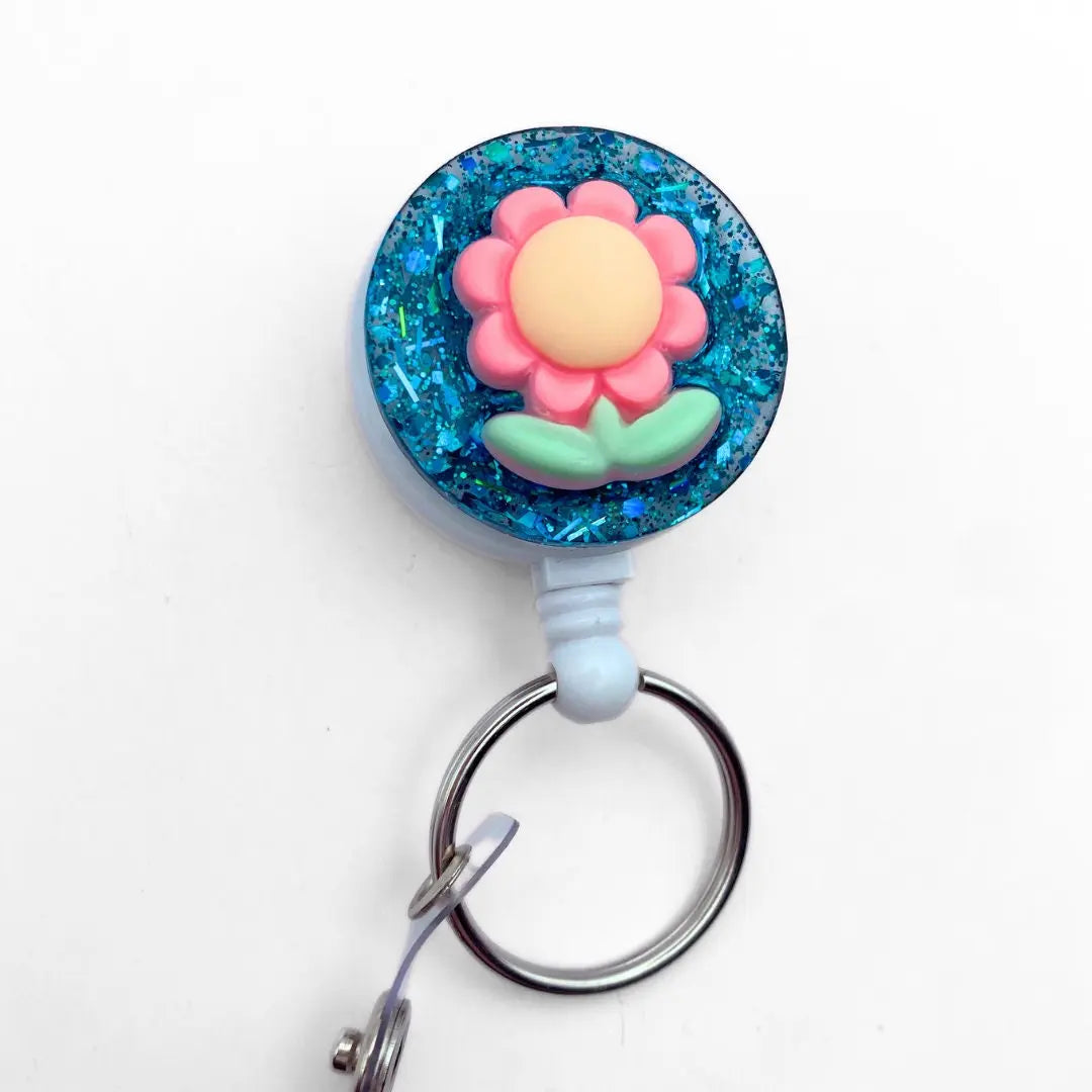 Lightweight badge reel - green glitter and flower.