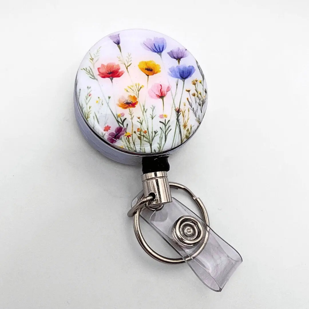 a badge holder with a flower design on it