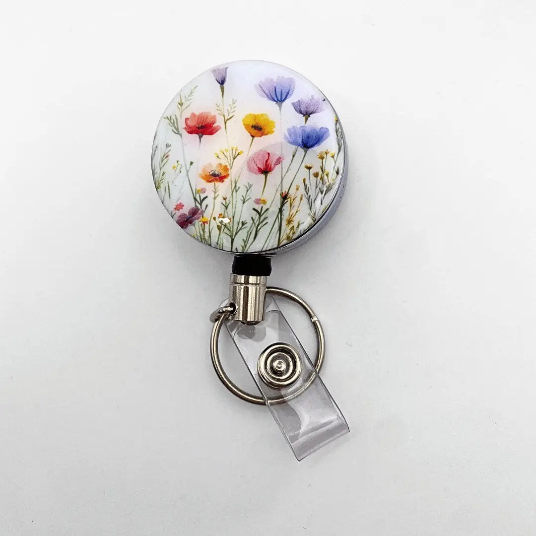 a badge holder with a flower design on it