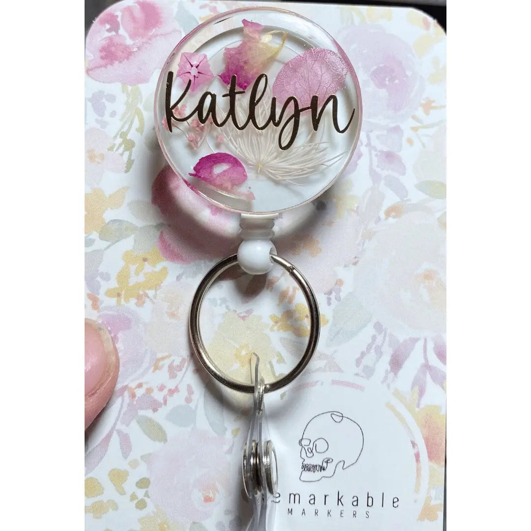 a keychain that has a picture of a flower on it