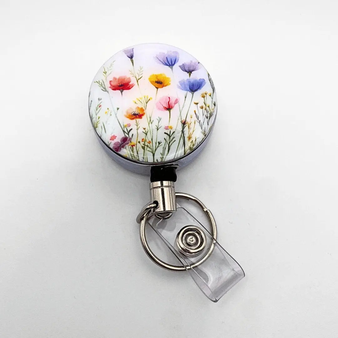 a badge holder with a flower design on it