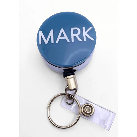 a blue badge with the word mark on it