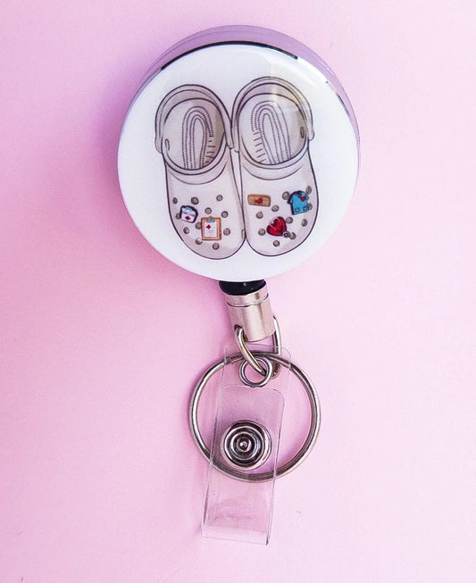 Theatre shoes on a heavy duty badge reel for nurses.